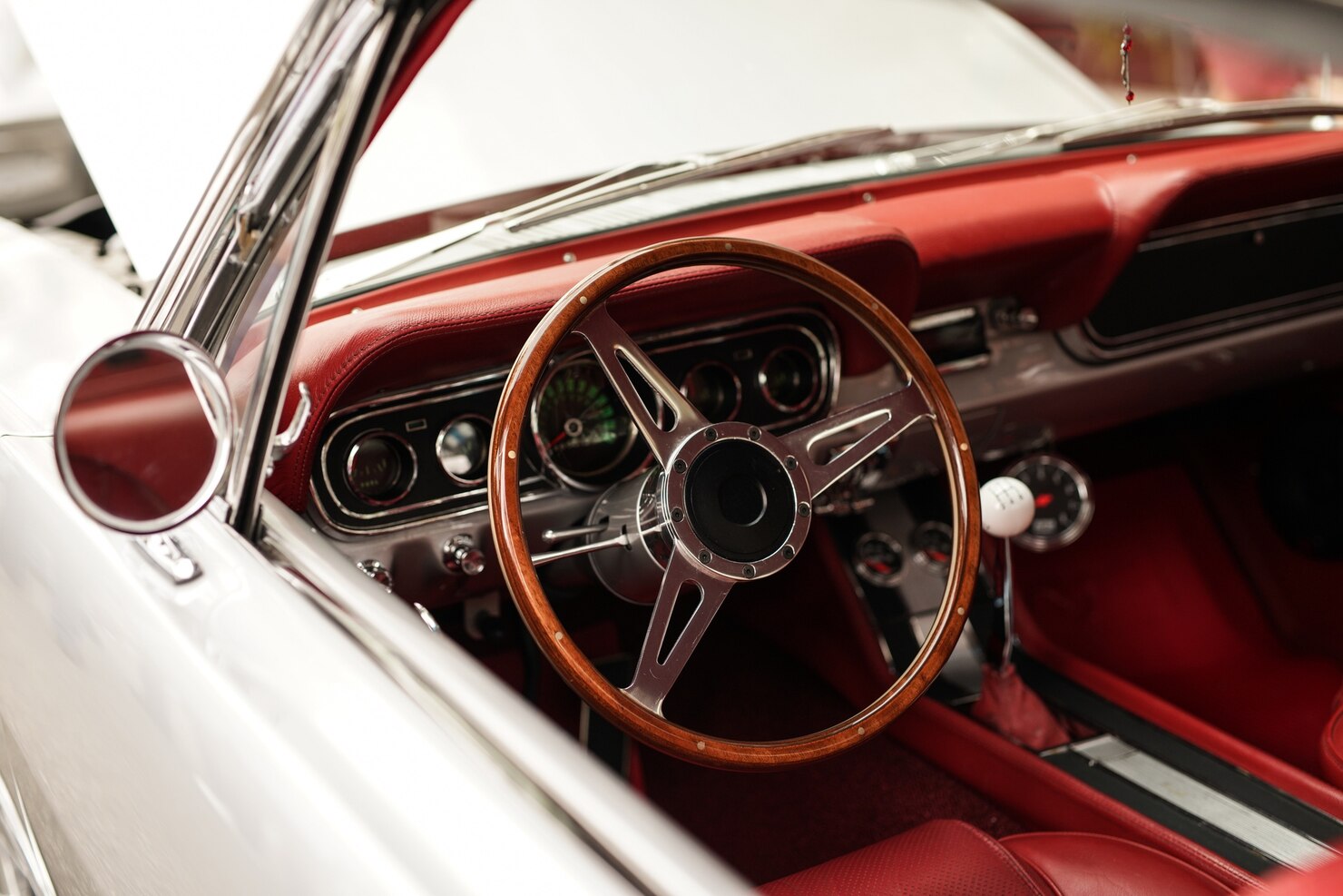 high-angle-closeup-shot-white-retro-car-with-beautiful-steering-wheel_181624-26910